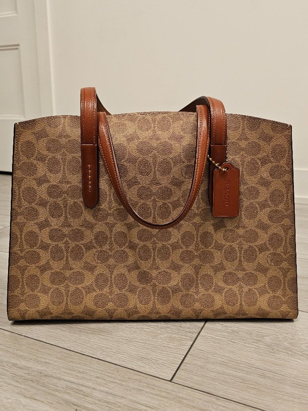 Coach Charlie Carryall – Signature Canvas (Brass/Rust)